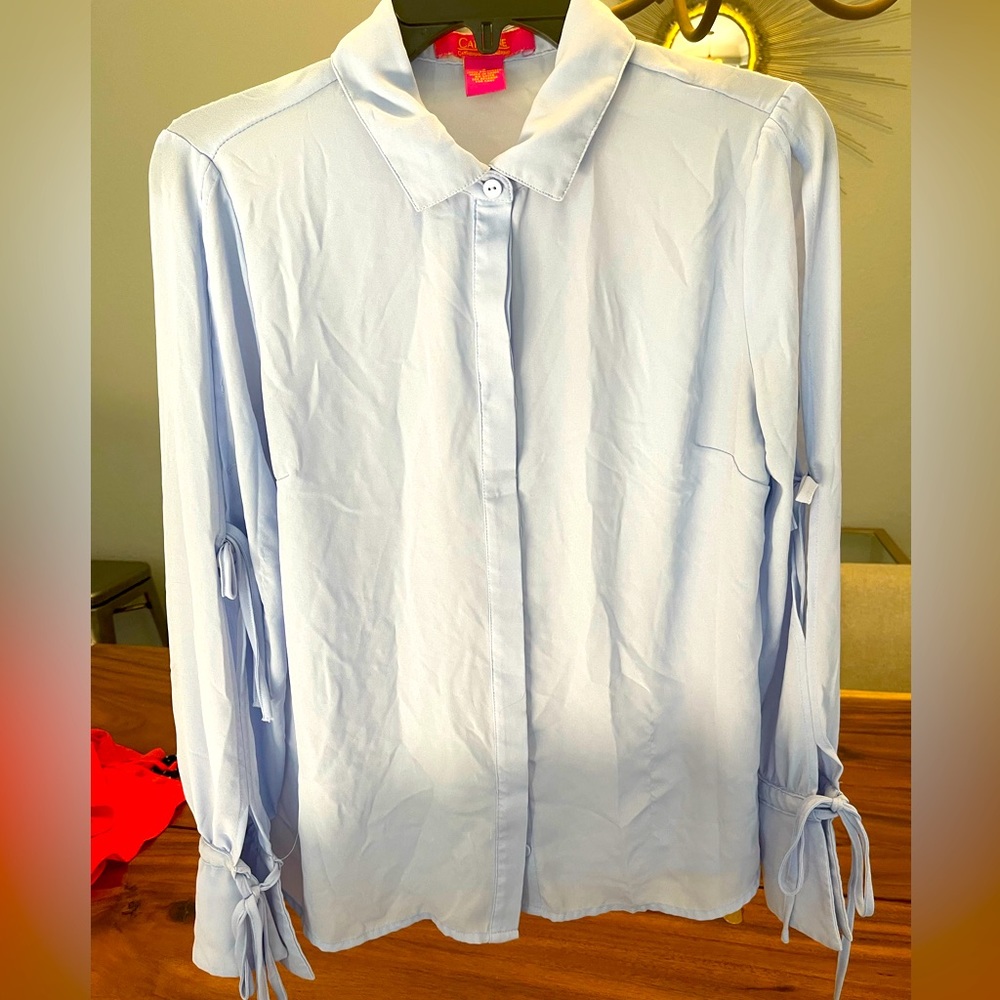 Light blue button up blouse with tie detailed sleeves